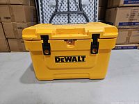 Front view of yellow DeWALT cooler with black latches and logo