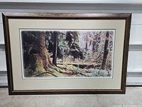 Full view of framed forest landscape print