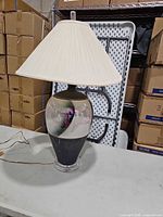 Full view of lamp showing body, shade, cord, acrylic base