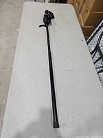 Full view of extended Manfrotto monopod showing overall length and rubber foot