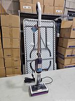 Full view of Shark SD205 steam mop standing upright with cord and purple pad