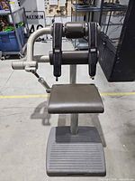 Front view of seated hip/glute abductor-adductor machine showing overall structure and components