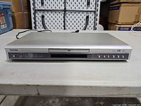 Front view of silver Toshiba SD-3500 DVD player showing tray and control buttons