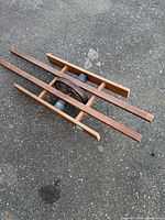 Top view of full wooden slatted pulley on pavement