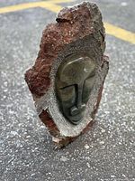 Front view showing polished face and rough stone surround