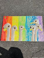 Full view of painting showing six emu heads and rainbow background