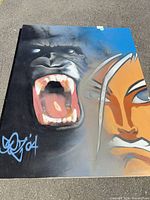 Full view of graffiti painting showing gorilla and fighter imagery
