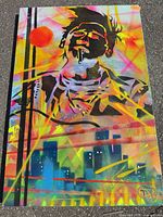 Full angled view of the entire spray paint artwork outdoors on pavement