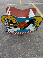 Side view showing full horse graphic and rocker base