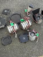 Group of fresnel lights, barn doors and frames on pavement