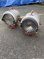 Front view showing both lights, wire grills, lenses, bases