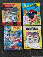Group shot showing all four boxed costumes
