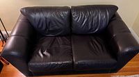 Front view of leather couch showing overall design and colour