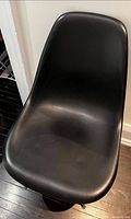 Top view of one black molded plastic side chair