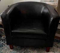 Front view of brown faux leather tub chair
