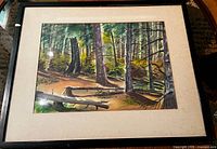 Full view of framed watercolour in black frame with cream mat