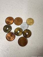 All eight Japanese coins laid out on tabletop