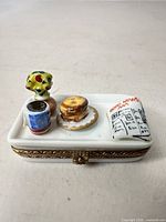 Top view of Limoges trinket box showing breakfast tray details