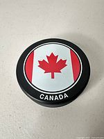 Front face showing Canada flag maple leaf graphic and CANADA text