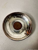 Full view of sterling coaster with inset coin