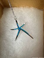 Front view of starfish pendant showing blue opal inlay