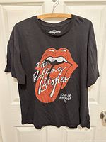 Front view showing Rolling Stones lips logo and tour graphic