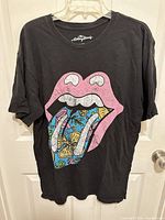 Full front view of T-shirt on hanger