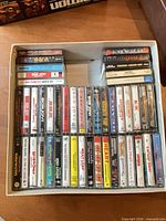 Full view of box holding approximately 40 cassette tapes