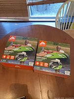 Front view of both boxed Rapid Rider I tubes on table