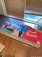Retail box top showing Street Tennis branding and imagery