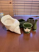 group view of all five ceramic pieces on table