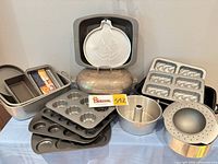 Group shot showing all baking and roasting pans on table