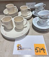 Corelle mugs, plates and porcelain tea set grouped