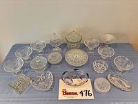 All 17 crystal glass dishes displayed on table