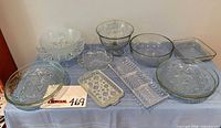 All ten glass serving pieces grouped on table