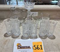 Front view of tumblers, pitcher, candle holder and bowl