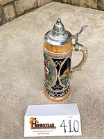 Full view of stein with pewter lid and handle