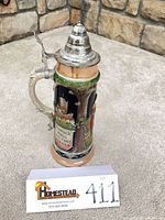 Full view of stein with lid closed showing height and design