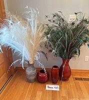 Full view of all four vases with feather arrangements