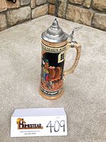 Full view of beer stein with lid closed showing overall form