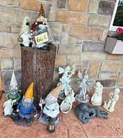 Full group of gnomes, fairies, children, elephant and wreath displayed