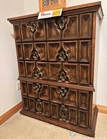 Front view of five-drawer dresser showing raised panel drawer fronts and hardware
