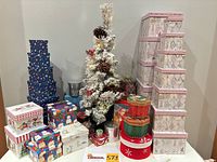 Full lot showing LED tree and assortment of holiday gift boxes