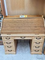 Front view of closed roll-top desk