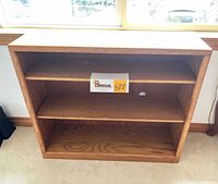 Front view showing three shelves and overall structure