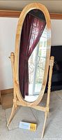full view of oval standing mirror front