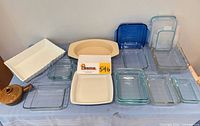 Full lot overview showing all glass, ceramic and stoneware bakeware pieces