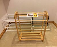 Front view showing wooden quilt rack and four shoe racks behind