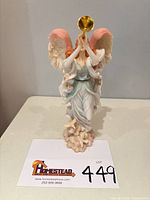 Front view of angel figurine showing overall design and size reference