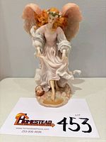 Front view of the Avalon "Free Spirit" angel figurine showing full form and base